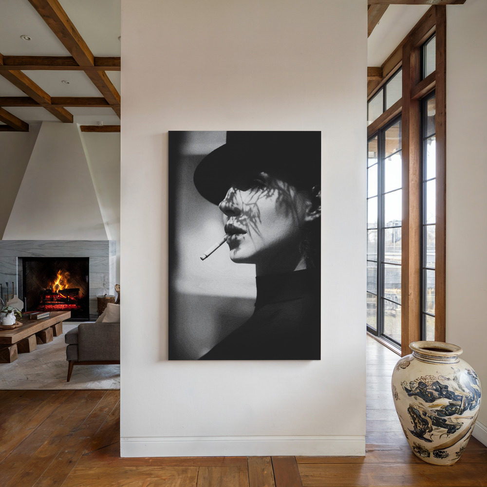 Canvas print - Lady in black by the fireplace